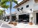 Charming restaurant exterior with outdoor seating and lush landscaping perfect for enjoying a meal at 2319 Webber St, Sarasota, FL 34239