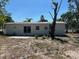 Large backyard with a patio, offering plenty of space for outdoor activities and entertaining at 2404 Lehigh Ave, Bradenton, FL 34207