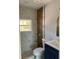 Updated bathroom featuring modern fixtures, marble and wood accent tiles, and a stylish vanity at 2404 Lehigh Ave, Bradenton, FL 34207