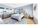 Calm bedroom showcasing a king bed, stylish blue accents, and scenic ocean views at 242 Hidden Bay Dr # 302, Osprey, FL 34229