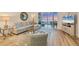 Relaxing living room with a cozy sofa, stylish armchair, and a scenic view from the lanai at 242 Hidden Bay Dr # 302, Osprey, FL 34229