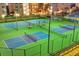 Well-lit tennis and pickleball courts offering evening play at 242 Hidden Bay Dr # 302, Osprey, FL 34229
