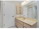 Bathroom features a single vanity and built in storage, with door to water closet at 25422 Aysen Dr, Punta Gorda, FL 33983