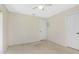 Bedroom featuring neutral carpet, ceiling fan, and closet with white doors at 25422 Aysen Dr, Punta Gorda, FL 33983