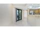 Dining area features sliding doors to outdoor patio and breakfast bar to kitchen at 25422 Aysen Dr, Punta Gorda, FL 33983