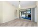 Bright dining room features sliding glass doors with views of the pool and backyard at 25422 Aysen Dr, Punta Gorda, FL 33983