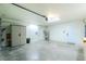 Bright and spacious two-car garage features ample storage, a water heater, and dual doors at 25422 Aysen Dr, Punta Gorda, FL 33983