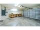 Spacious two-car garage with ample workspace and storage, ready for your projects at 25422 Aysen Dr, Punta Gorda, FL 33983
