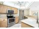 Kitchen featuring stainless steel oven and microwave at 25422 Aysen Dr, Punta Gorda, FL 33983