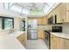Kitchen featuring stainless steel appliances and a double basin sink at 25422 Aysen Dr, Punta Gorda, FL 33983