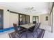 Lanai with a dining table, perfect for enjoying outdoor meals and views of the backyard at 25422 Aysen Dr, Punta Gorda, FL 33983