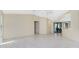 Open-concept living room with tile flooring seamlessly connects to the kitchen at 25422 Aysen Dr, Punta Gorda, FL 33983