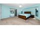 Spacious main bedroom with ensuite bathroom and sliding door to backyard at 25422 Aysen Dr, Punta Gorda, FL 33983