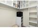Neat walk-in closet with shelving and storage space, designed for organization and convenience at 25422 Aysen Dr, Punta Gorda, FL 33983