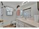 Bright bathroom featuring a window, and vanity at 27142 Villarrica Dr, Punta Gorda, FL 33983