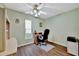 Bedroom with ceiling fan, window, and wood-look flooring at 27142 Villarrica Dr, Punta Gorda, FL 33983