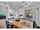 Open concept dining area showcases wood floors and an eat-in kitchen with stainless appliances at 27142 Villarrica Dr, Punta Gorda, FL 33983