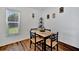 Cozy dining area with a wooden table set, natural light, and stylish decor at 27142 Villarrica Dr, Punta Gorda, FL 33983