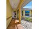 Inviting screened entryway with tiled flooring and a glimpse of the home's interior at 27142 Villarrica Dr, Punta Gorda, FL 33983