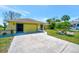 Charming yellow single-story home with a well-maintained lawn and a spacious driveway at 27142 Villarrica Dr, Punta Gorda, FL 33983
