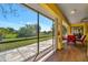 Screened lanai overlooking a fenced backyard and lush greenery provides ample outdoor space at 27142 Villarrica Dr, Punta Gorda, FL 33983