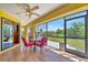 Screened lanai perfect for outdoor dining, overlooks the lush green lawn and backyard at 27142 Villarrica Dr, Punta Gorda, FL 33983