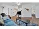 Spacious living room featuring vaulted ceilings, wood floors, and a clear view to the dining area at 27142 Villarrica Dr, Punta Gorda, FL 33983