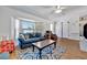 Cozy living room featuring a bay window, comfortable seating, and stylish decor at 27142 Villarrica Dr, Punta Gorda, FL 33983