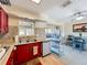 Bright eat-in kitchen features stainless appliances, tile backsplash, and backyard views at 2845 64Th S Ter, St Petersburg, FL 33712