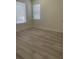 Neutral bedroom with gray flooring and multiple windows at 3204 W Grace St, Tampa, FL 33607