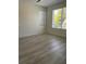 Bright bedroom with natural light and wood-look flooring at 3204 W Grace St, Tampa, FL 33607