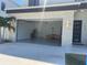 Spacious two-car garage with epoxy flooring and modern lighting fixtures at 3204 W Grace St, Tampa, FL 33607
