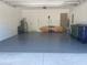 Spacious garage featuring an epoxy floor and ample space for storage and vehicles at 3204 W Grace St, Tampa, FL 33607
