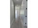 Bright hallway featuring recessed lighting, clean white walls, and wood-look flooring throughout the home at 3204 W Grace St, Tampa, FL 33607
