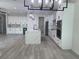 Open kitchen features white cabinetry, stainless appliances, marble countertops and backsplash, and pendant lighting at 3204 W Grace St, Tampa, FL 33607