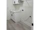 Well-organized laundry room with white cabinets and marbled countertop at 3204 W Grace St, Tampa, FL 33607