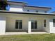 Covered patio with sliding glass doors, offering a seamless transition to outdoor living and backyard views at 3204 W Grace St, Tampa, FL 33607