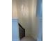 Stairway with a contemporary light fixture and dark metal railing at 3204 W Grace St, Tampa, FL 33607