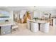 Open-concept dining area with modern furnishings, adjacent to kitchen and staircase at 322 Beach Rd, Sarasota, FL 34242