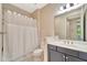 Bathroom with a shower-tub combination and gray vanity with a white countertop and modern lighting at 324 Casalino Dr, Nokomis, FL 34275