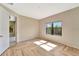 Bedroom featuring herringbone floors, neutral walls, and large window for natural light at 324 Casalino Dr, Nokomis, FL 34275