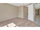 Bright bedroom featuring herringbone pattern floors and view to hallway at 324 Casalino Dr, Nokomis, FL 34275