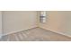 Neutral bedroom with carpet, a window with blinds, and tan walls at 324 Casalino Dr, Nokomis, FL 34275