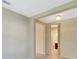 Hallway leading to rooms with neutral walls at 324 Casalino Dr, Nokomis, FL 34275