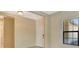 Hallway with front door, side window, and neutral wall color at 324 Casalino Dr, Nokomis, FL 34275