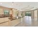 Modern kitchen featuring an island with countertop seating, tiled backsplash, and stainless steel appliances at 324 Casalino Dr, Nokomis, FL 34275