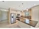 Bright kitchen showcasing an island with seating, stainless steel appliances, and stylish pendant lighting at 324 Casalino Dr, Nokomis, FL 34275