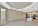 Open-concept living space with tile flooring, recessed lighting, and an adjacent kitchen area at 324 Casalino Dr, Nokomis, FL 34275