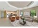 A spacious living room features an open-concept design connecting the kitchen and dining areas, perfect for modern living at 324 Casalino Dr, Nokomis, FL 34275