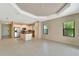 Bright and open living space with tile flooring, modern kitchen, and abundant natural light at 324 Casalino Dr, Nokomis, FL 34275